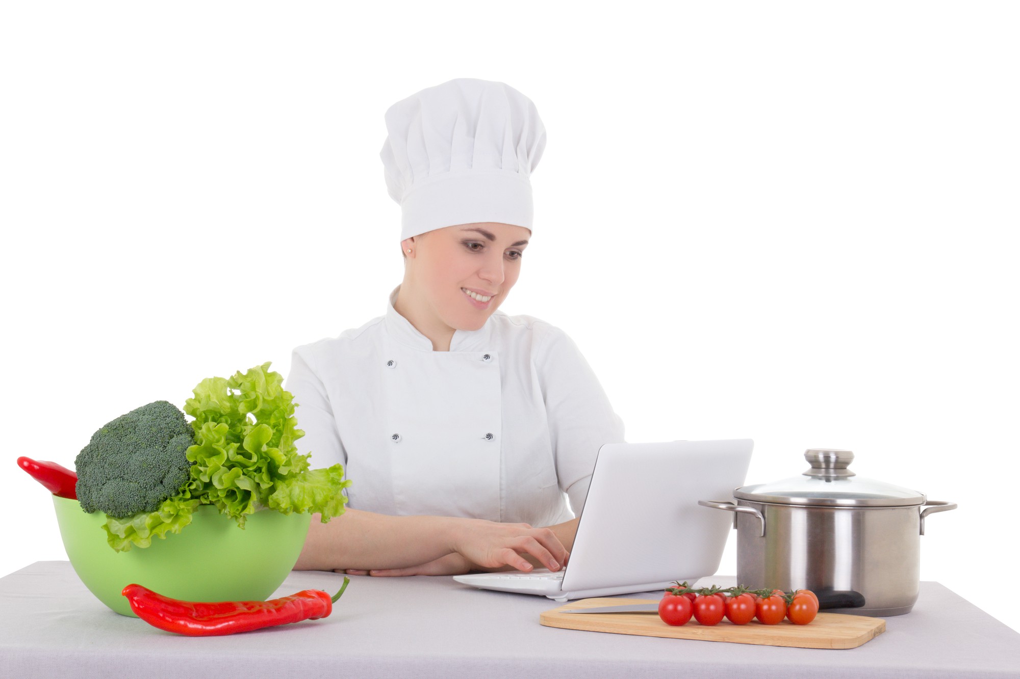 Student cooking in online class with chef on screen